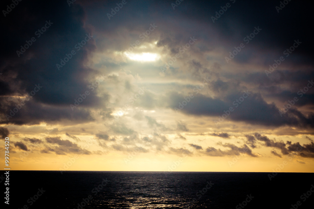 Sun and clouds above the sea