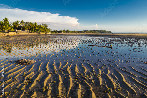 Foto Water sky reflection on a low tide beach
