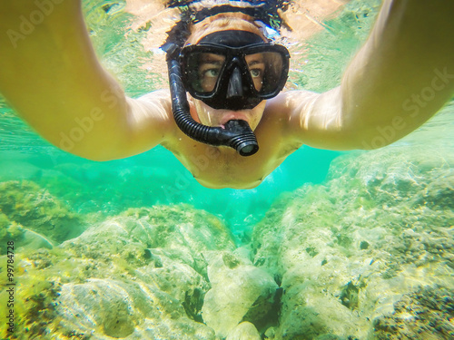Underwater selfie shot. Snorkeling just below the surface.