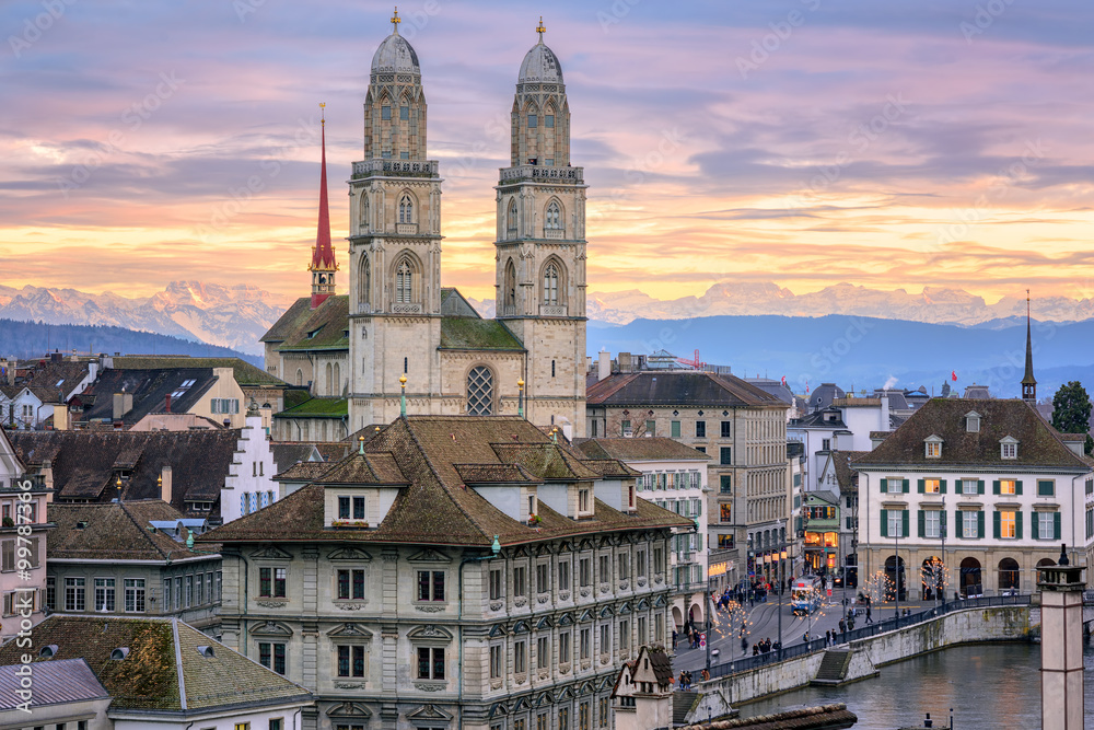 Zurich city center with snow covered Alps mountains in backgroun