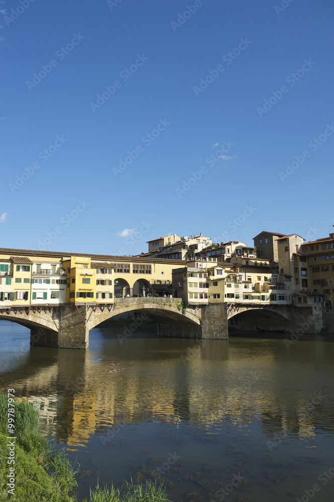 Ponte Vecchio in Florence Italy with skyline reflection on the Arno River