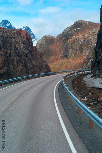 Grey road in mountains of Lofoten in Norway photo