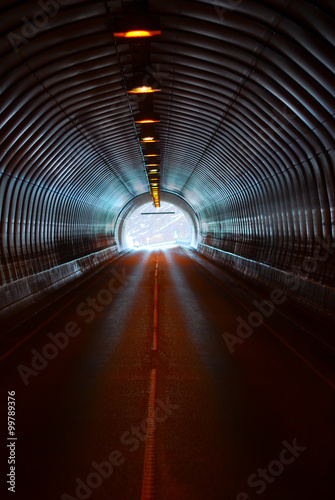 Long dark road tunnel