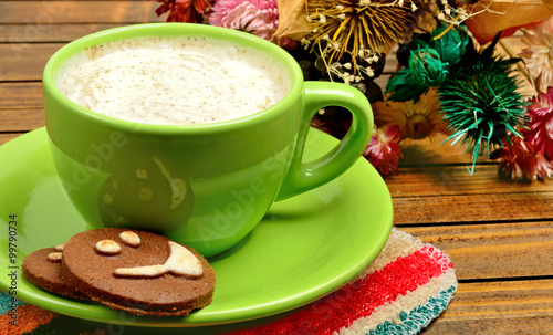 Cup of cappuccino with cocoa biscuits
