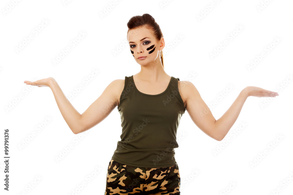 Young soldier woman presenting something on open palm Young soldier woman presenting something on open palm