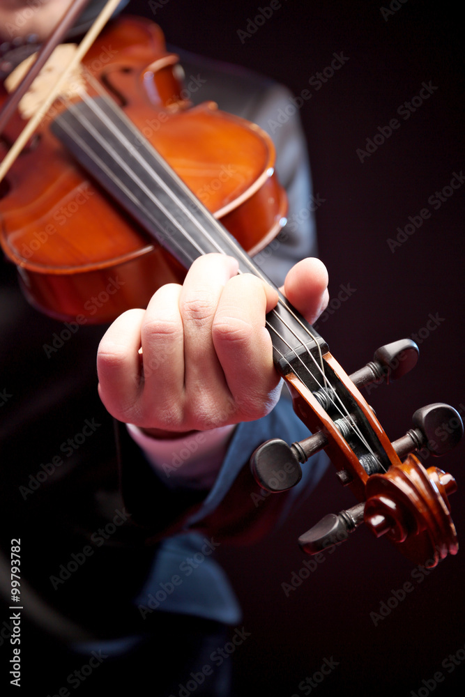 Fototapeta premium Violinist's performance on black background, close up