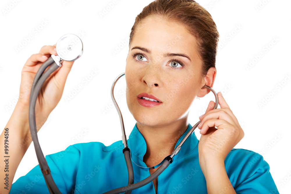 Young female doctor or nurse with stethocope Young female doctor or nurse with stethocope