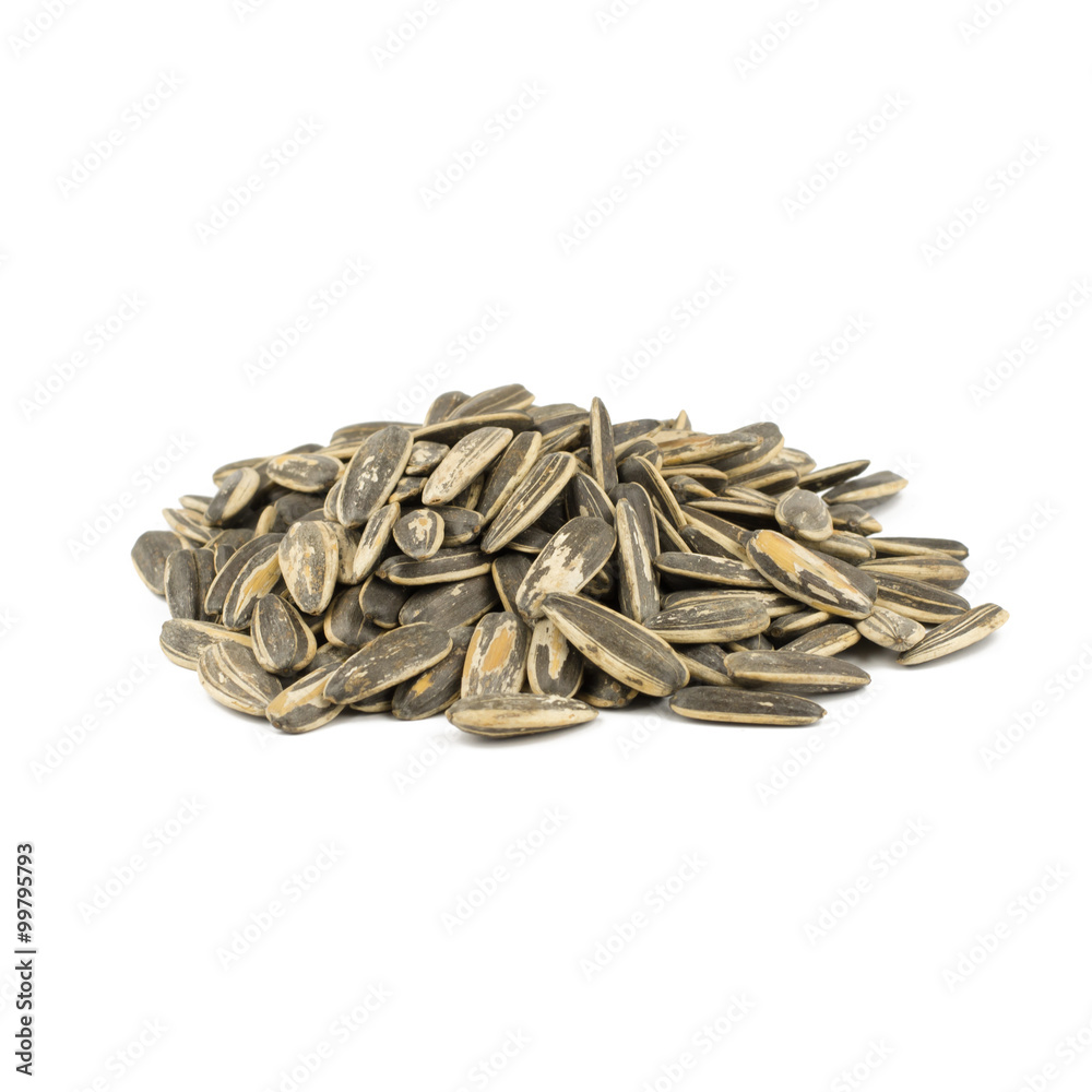 sunflower seeds pile against white background sunflower seeds pile against white background