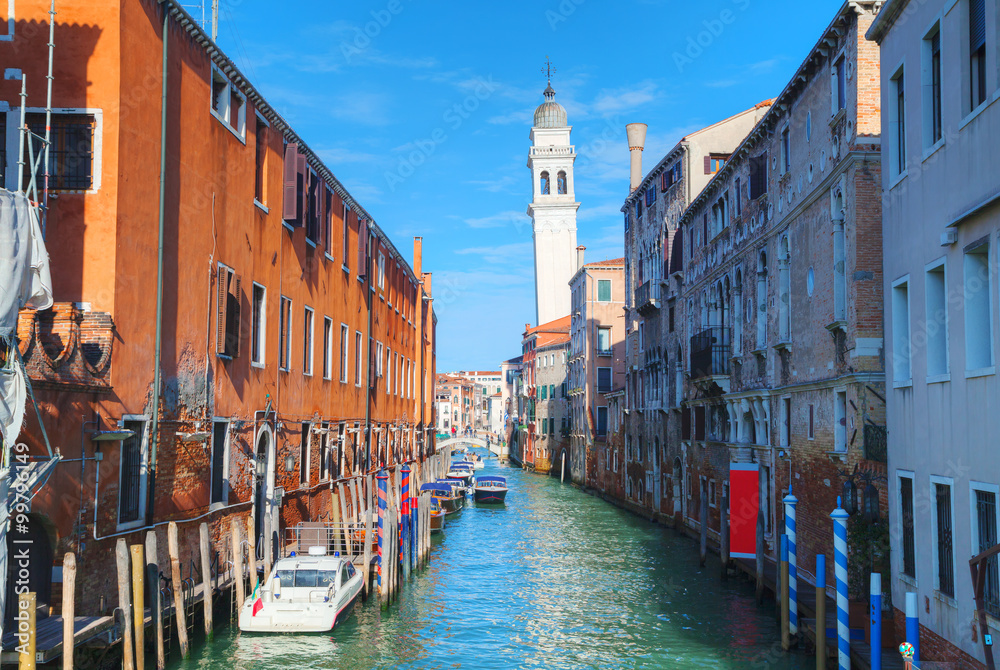 Narrow canal with bridge in Venice