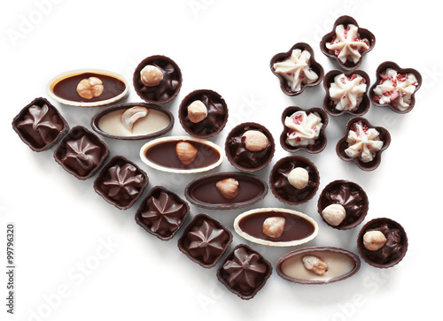 Composition of chocolate candies on white background