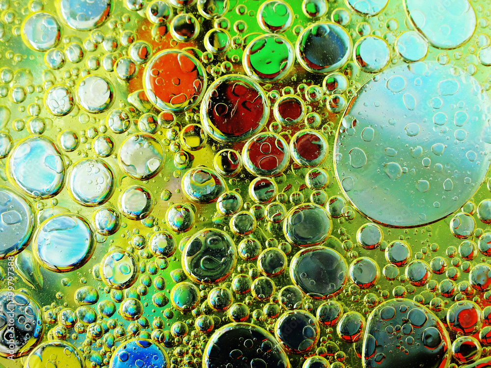 Olive oil bubbles in water close up Olive oil bubbles in water close up