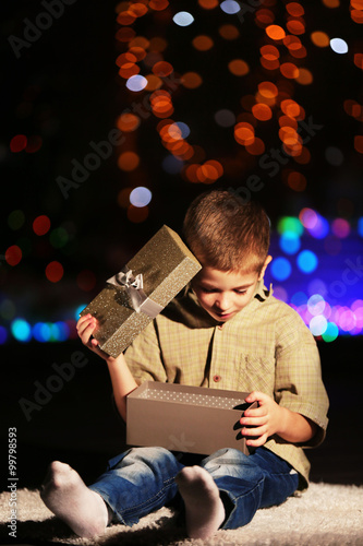 Little boy with gift box on...