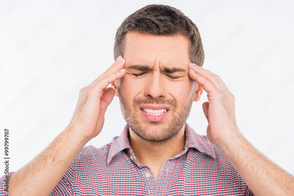 Attractive man suffering of headache Attractive man suffering of headache