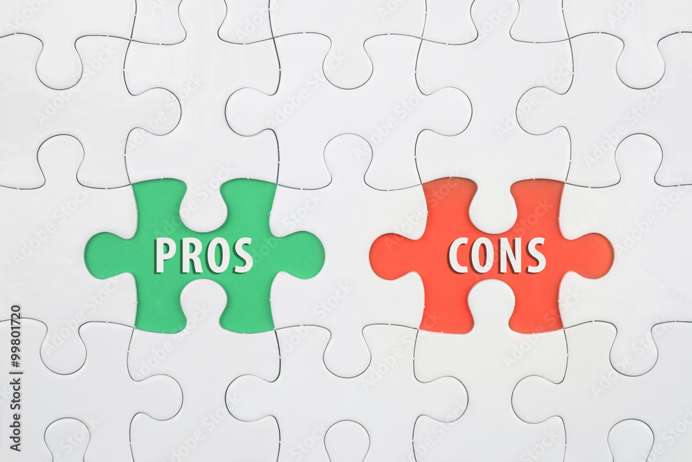 Jigsaw puzzle on color paper background with a word PROS and CONS Jigsaw puzzle on color paper background with a word PROS and CONS