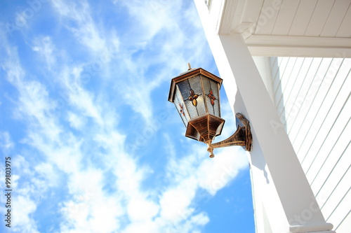 Front Porch Light Installed At White Pillar