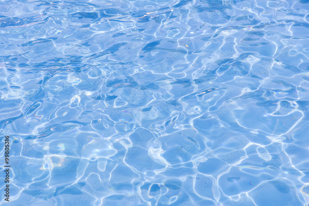 blue swimming pool with sunny reflections