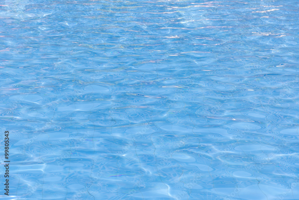 blue swimming pool with sunny reflections