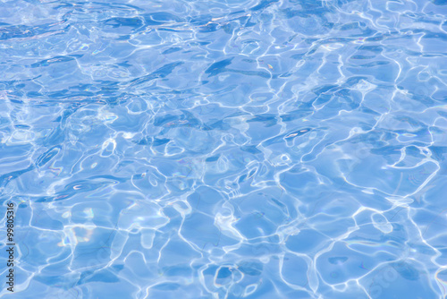 blue swimming pool with sunny reflections