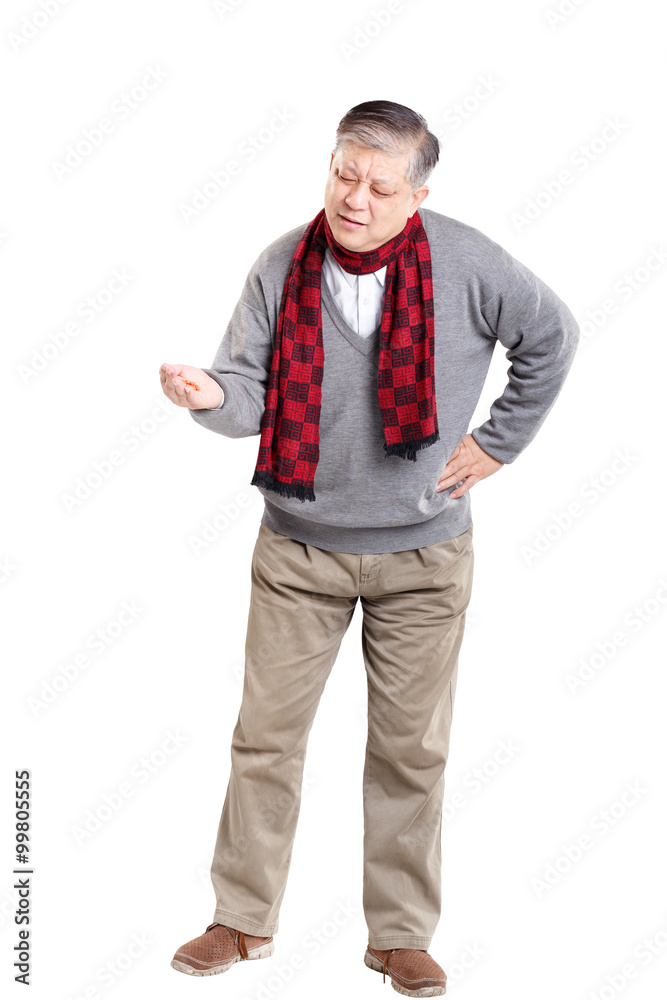 Old Asian man in sweater taking medcine Old Asian man in sweater taking medcine