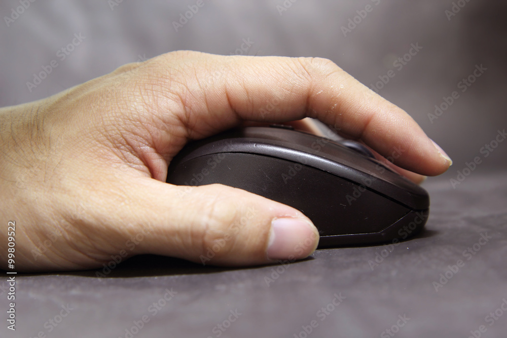 soft focus to hand of the man clicking mouse soft focus to hand of the man clicking mouse
