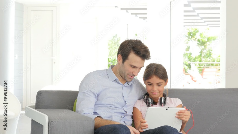 Father and daughter using digital tablet Father and daughter using digital tablet