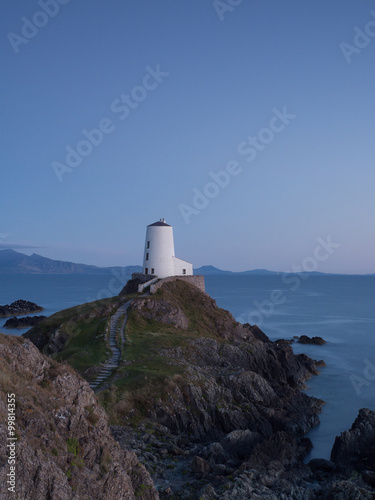 Lighthouse in North Wales on a hill in last light Llanddwyn lighthouse Newborough, Anglesey