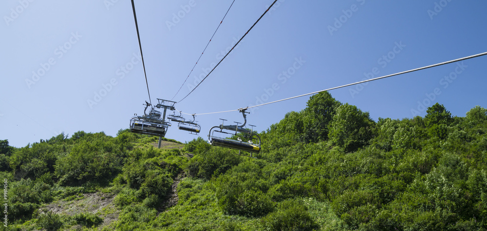 Chair lift above the mountains