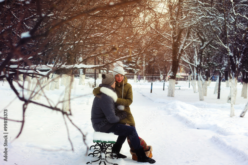 lovers on a bench in winter