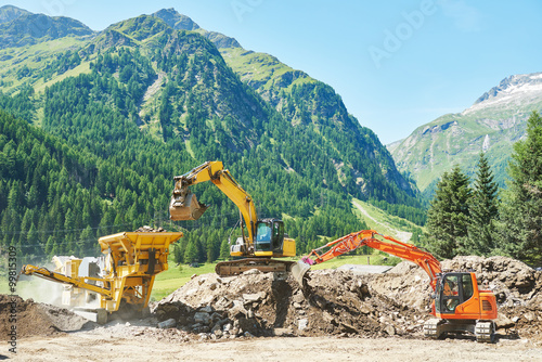 excavator and stone crusher machine photo
