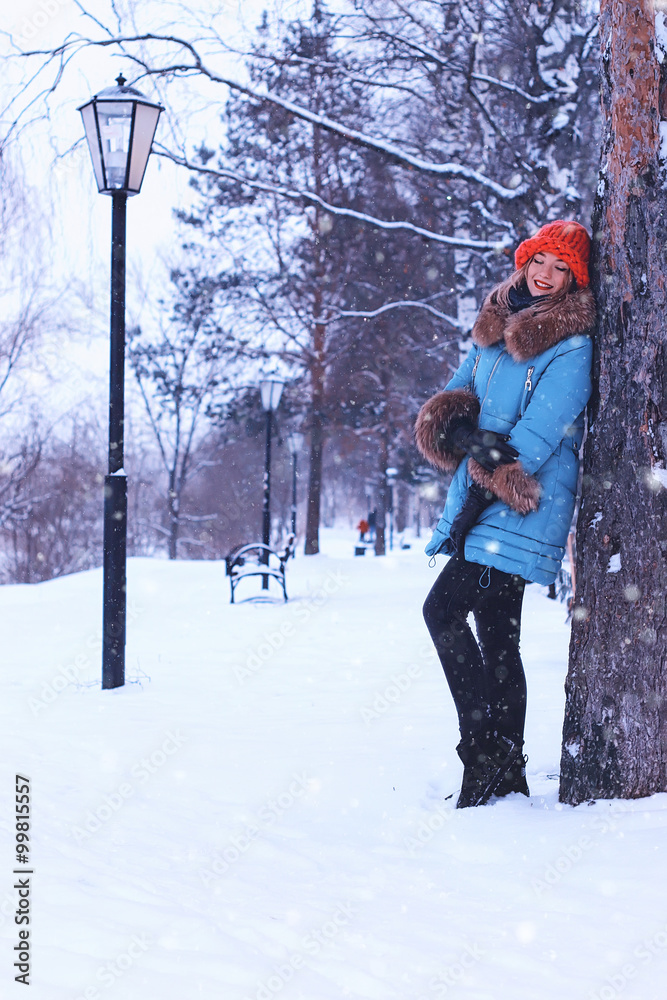 girl in winter near tree