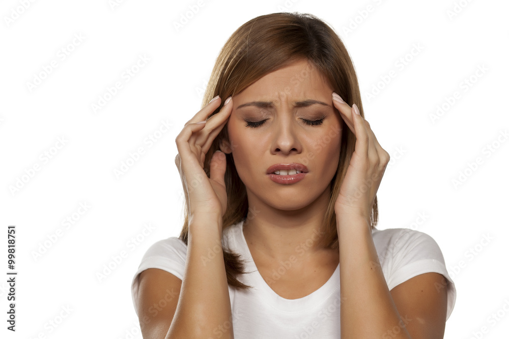 young beautiful woman with a strong headache young beautiful woman with a strong headache