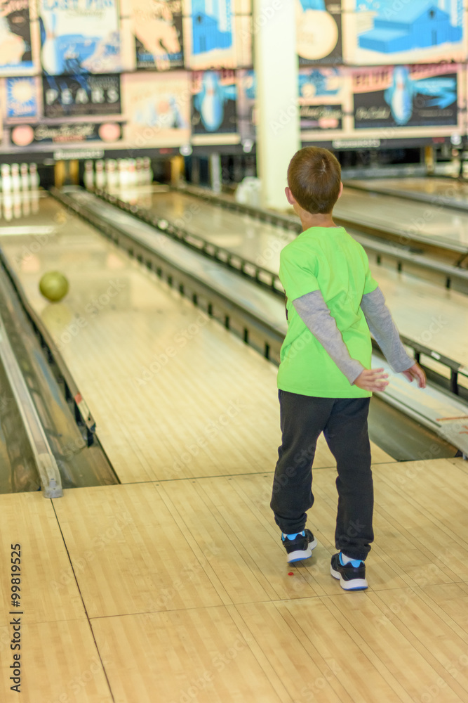 Kid playing bowling