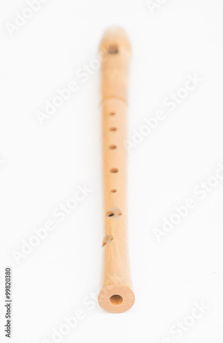 Wooden recorder on white background