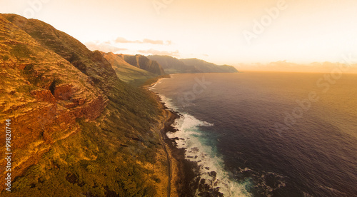 Sunset aerial view of beautiful Kaena coast on the north west of Oahu, Hawaii at sunset. photo