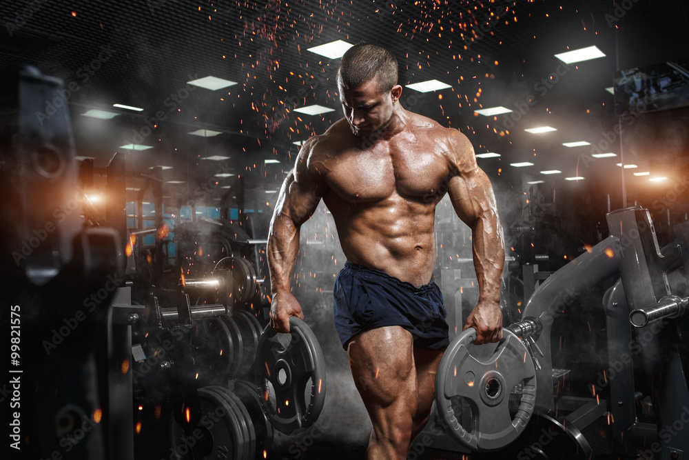 Muscular athletic bodybuilder fitness model posing after exercises in gym  Foto, Poster, Wandbilder bei EuroPosters