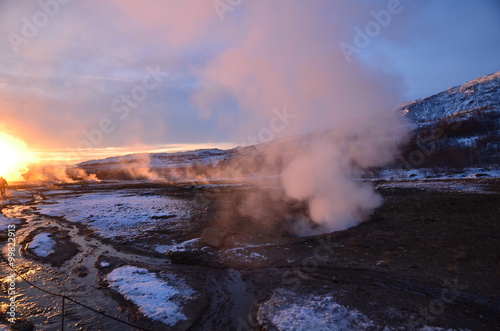 Steam is rising from a hot spring in Haukaladur in Iceland during sunset