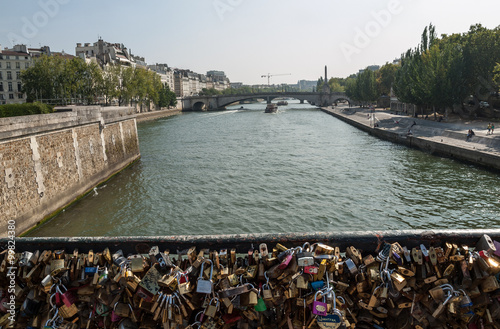 Paris - Pont de l'Archeveche (Archbishop's Bridge)covered with love padlocks. The Pont de l'Archeveche is the narrowest road bridge in Paris