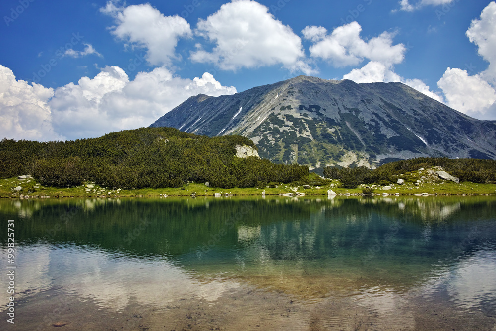 Amazing view of Todorka Peak and reflection in Muratovo lake, Pirin Mountain, Bulgaria Amazing view of Todorka Peak and reflection in Muratovo lake, Pirin Mountain, Bulgaria