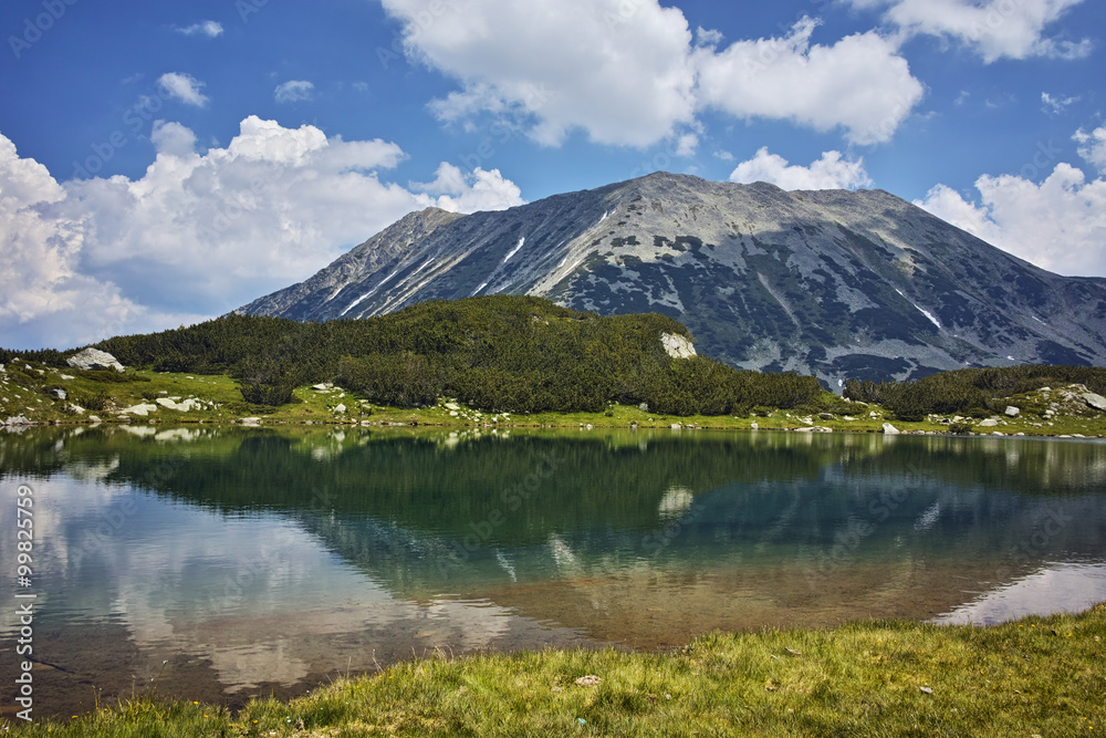 Amazing Panorama of Todorka Peak and reflection in Muratovo lake, Pirin Mountain, Bulgaria