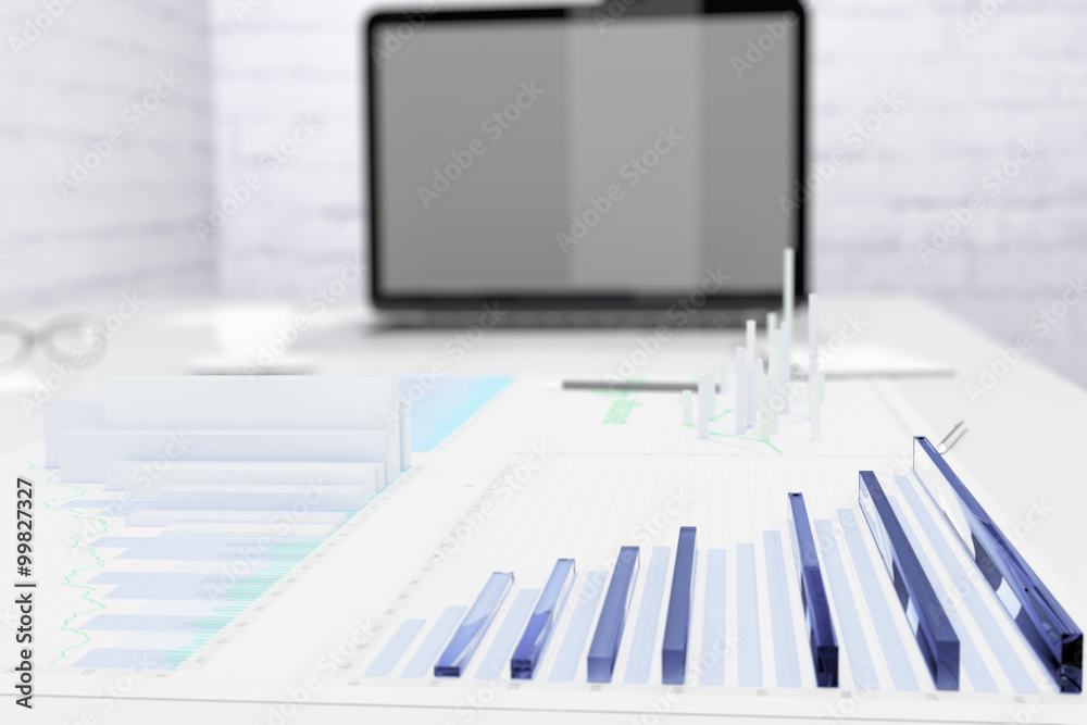 Obraz premium Financial charts on the desktop and laptop screen