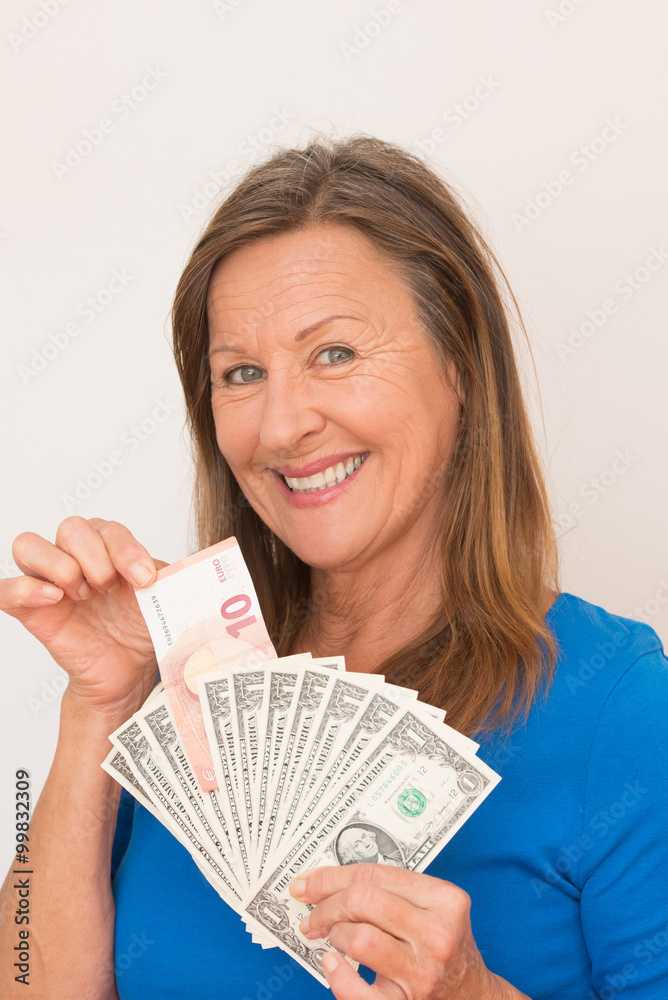 Smiling woman euro and dollar notes Smiling woman euro and dollar notes