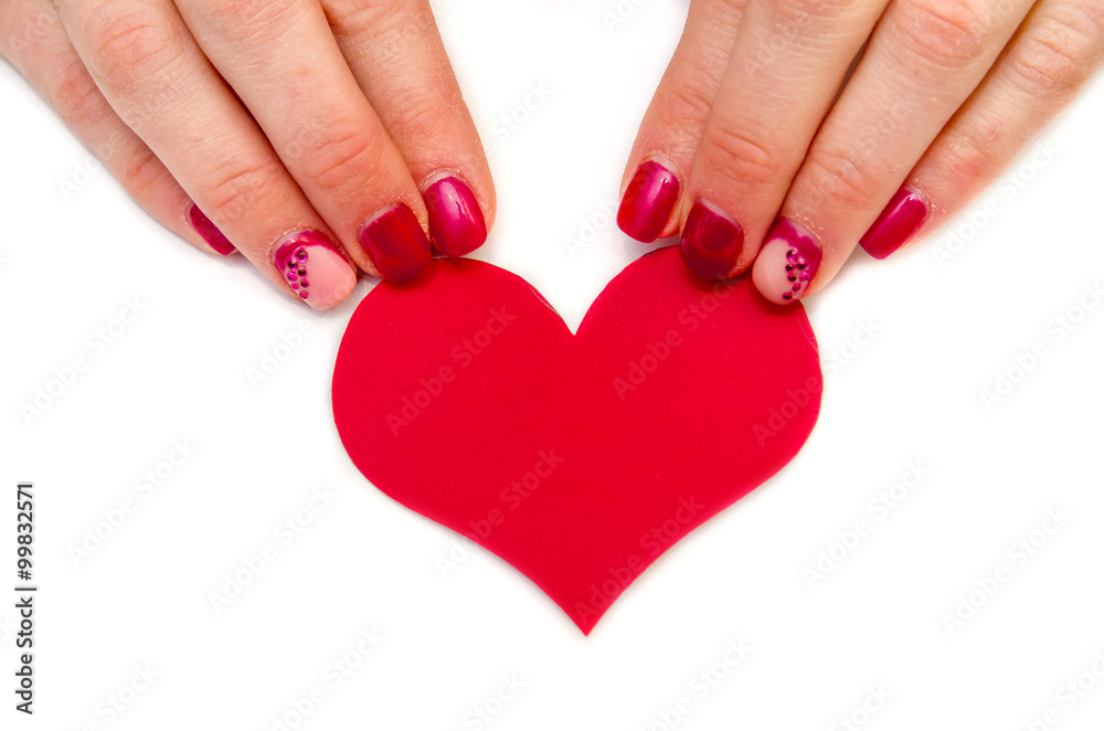 Woman hands holading red paper heart