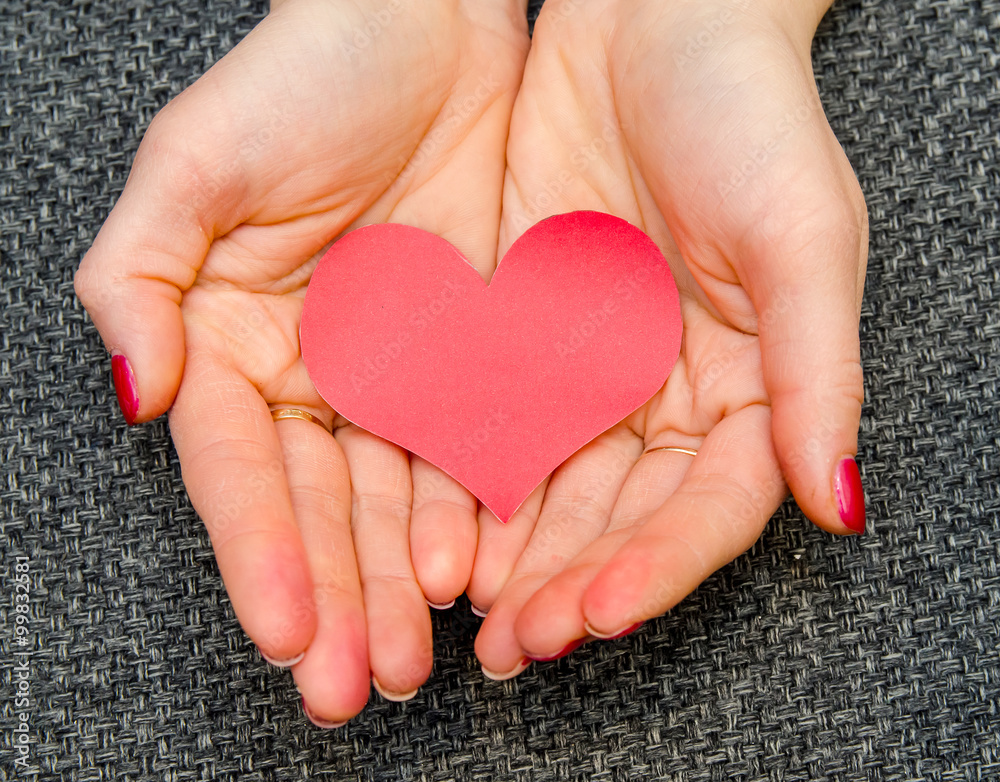 Fototapeta premium paper hearts on woman hand