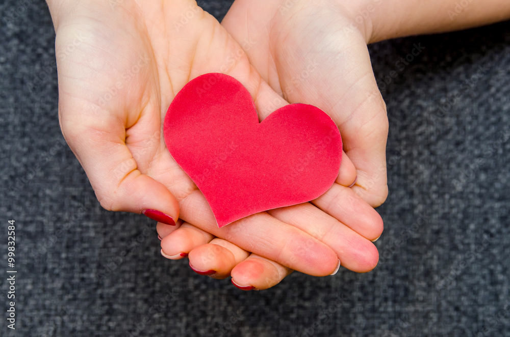 paper hearts on woman hand