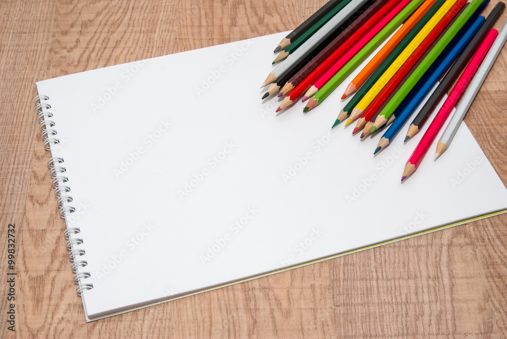 empty white sheet of paper with color pencils empty white sheet of paper with color pencils