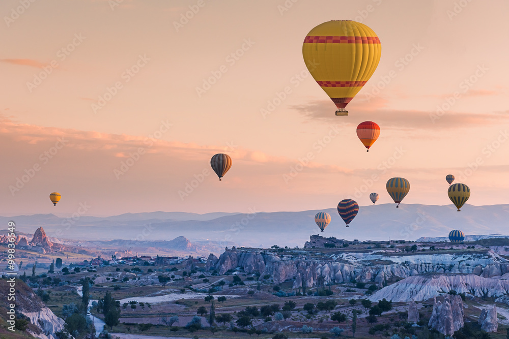 Obraz premium Hot air balloons fly over Cappadocia