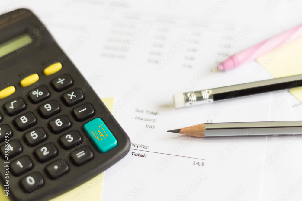 a calculator is on a balance sheet numbers are statistics. photo a calculator is on a balance sheet numbers are statistics. photo