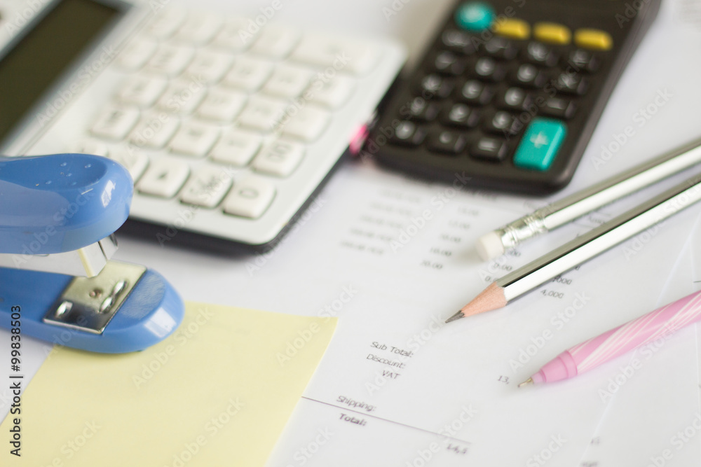 a calculator is on a balance sheet numbers are statistics. photo a calculator is on a balance sheet numbers are statistics. photo