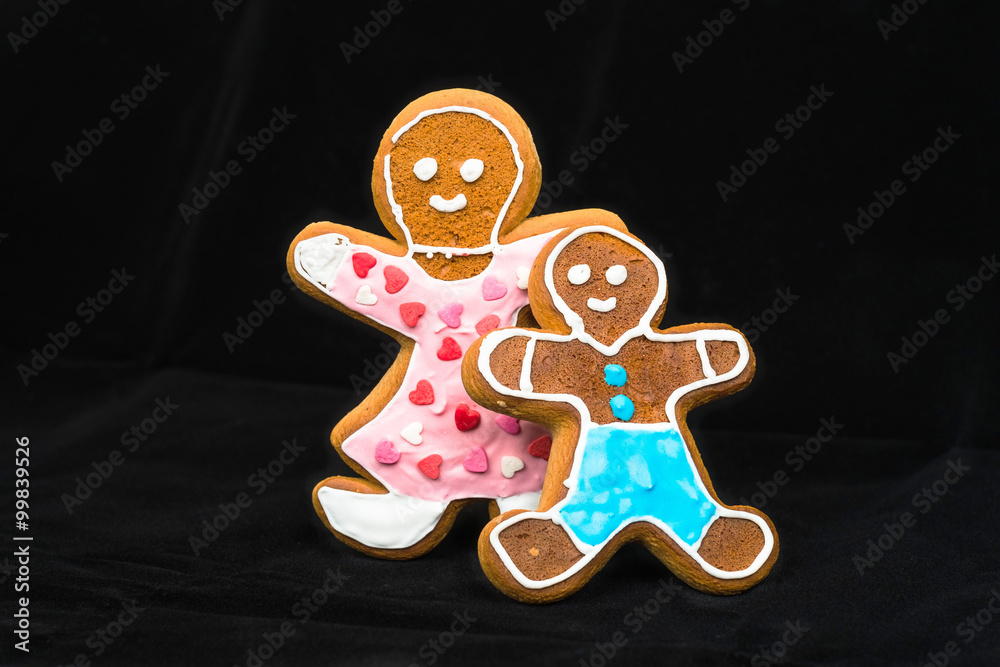 Gingerbread man, mother and son on black velvet Gingerbread man, mother and son on black velvet