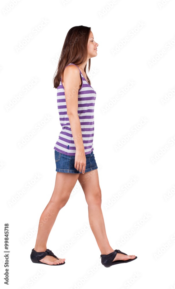 back view of walking woman . back view of walking woman .